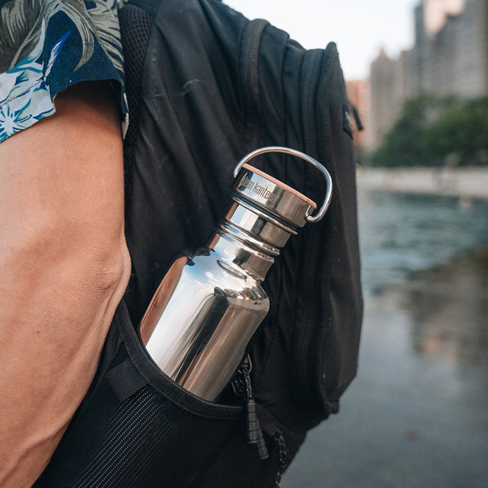 27oz-reflect-with-bamboo-cap-h3 K27SSLRF-MS-BAMBOO_reflect-bottle_backpack_lifestyle.jpg